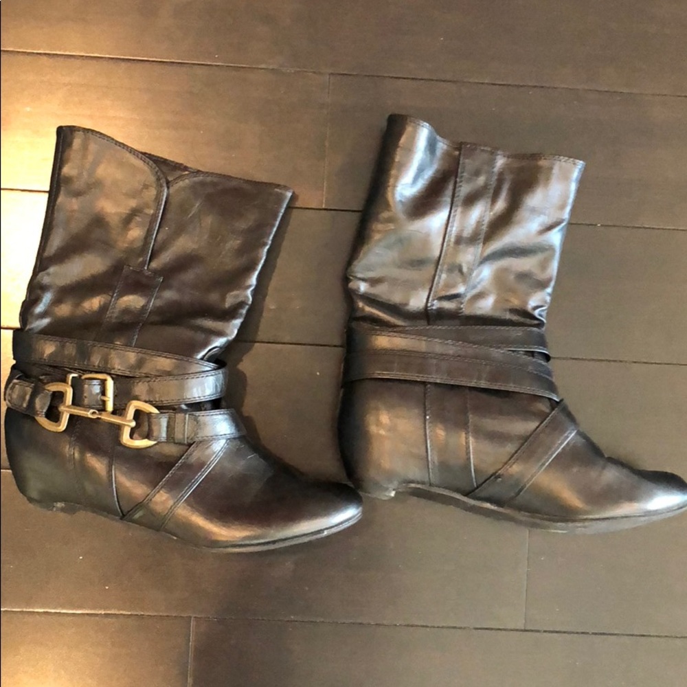 Black leather boots with buckle